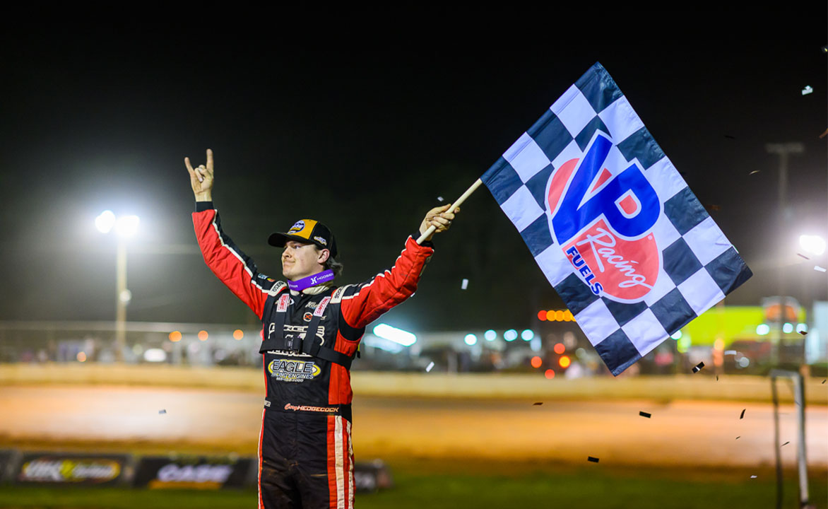 Cory Hedgecock celebrates in Victory Lane at 411