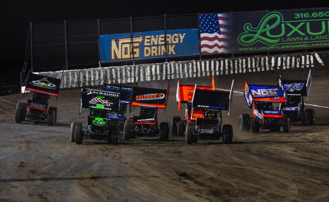 A pack of Sprint Cars races out of Turn 4 at 81 Speedway