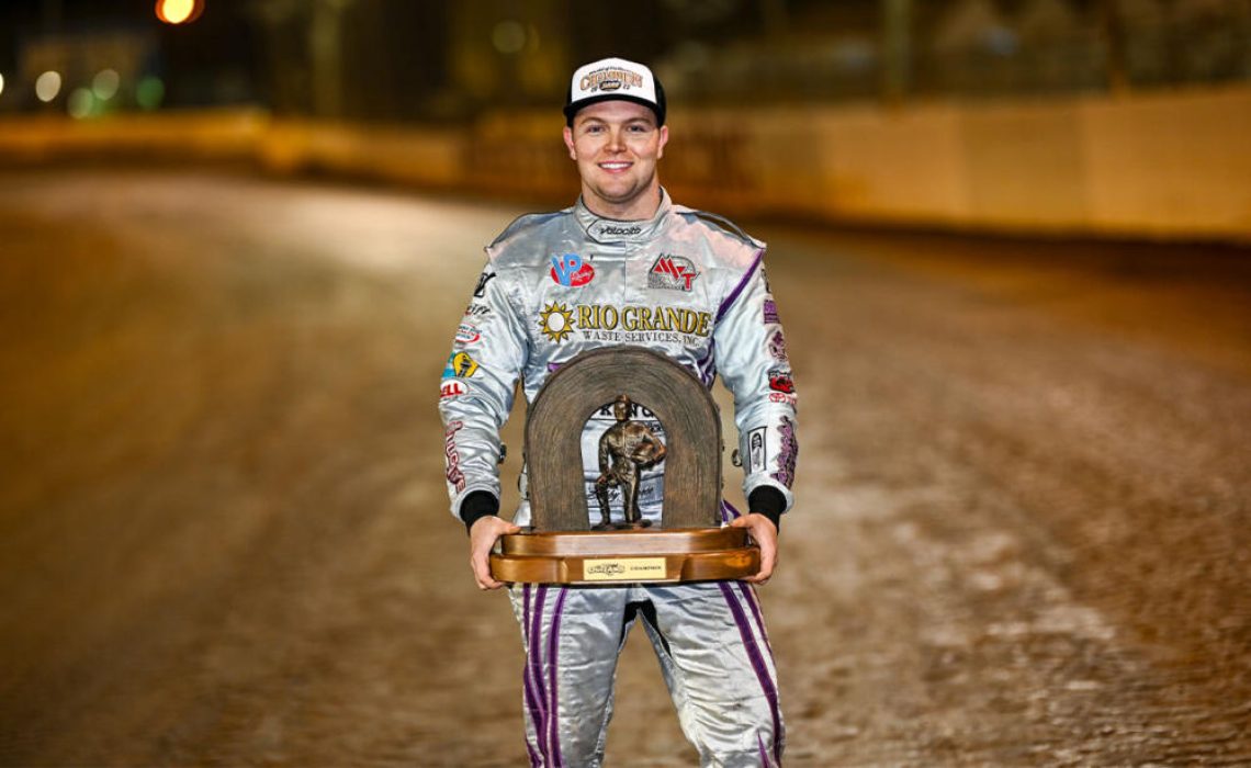 Bobby Pierce holds his championship trophy