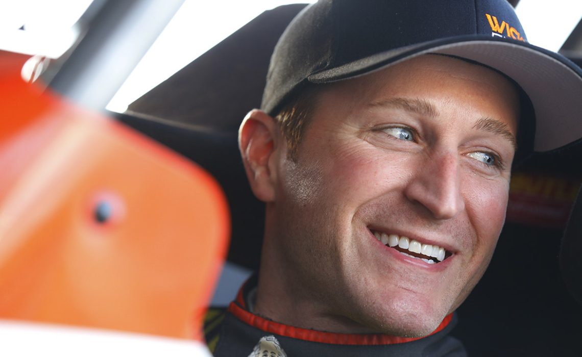 Kasey Kahne (9) hangs out behind his hauler before on-track action for the second night of the DIRTcar Nationals at the Volusia Speedway Park in DeLeon, Florida.