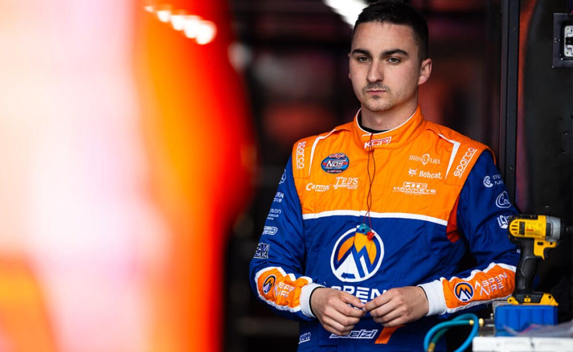 Giovanni Scelzi stands in the KCP Racing hauler